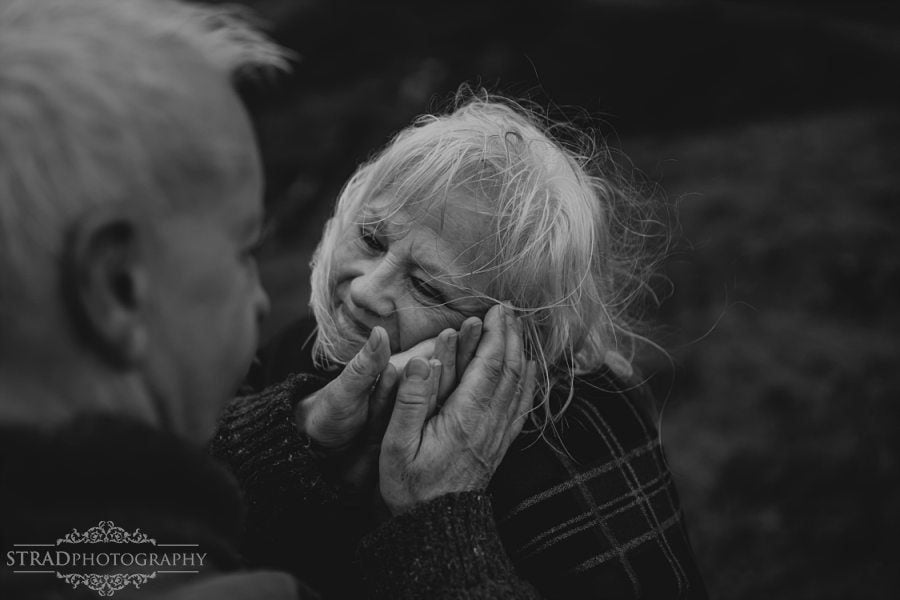 beautiful scenery, deers, elderly couple, engagement photography, glasgow photographer, glen etive, Glencoe, grandma, grandpa, hiking, kilt, landscapes, man and woman, marr, marriage, old couple, old married couple, older couple photo shoot in Glencoe Scotland, outlander, poncho, posing ideas, scotland, scottish couple, scottish highlands, senior couple, tartan