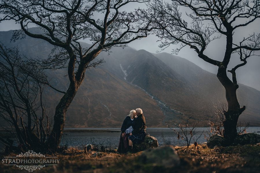 beautiful scenery, Loch Etive, deers, elderly couple, engagement photography, glasgow photographer, glen etive, Glencoe, grandma, grandpa, hiking, kilt, landscapes, man and woman, marr, marriage, old couple, old married couple, older couple photo shoot in Glencoe Scotland, outlander, poncho, posing ideas, scotland, scottish couple, scottish highlands, senior couple, tartan