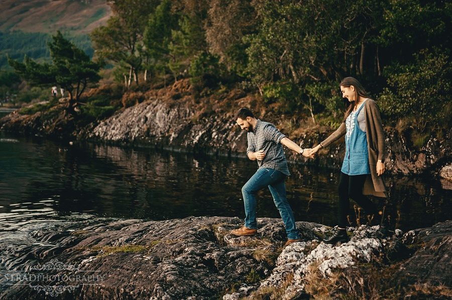 man pulls his wife to come with him