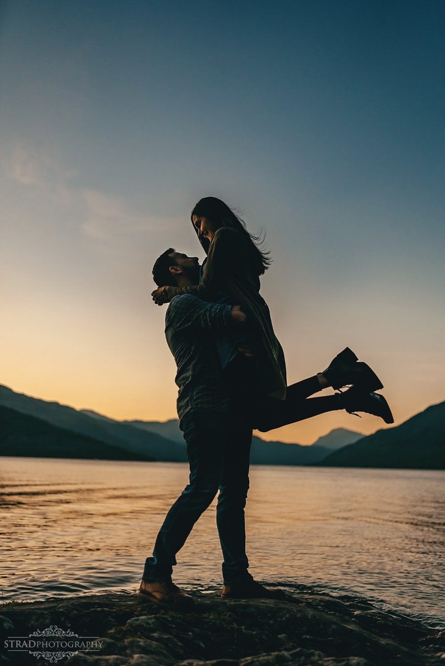 silhouette photo of a couple at the loch lomond 