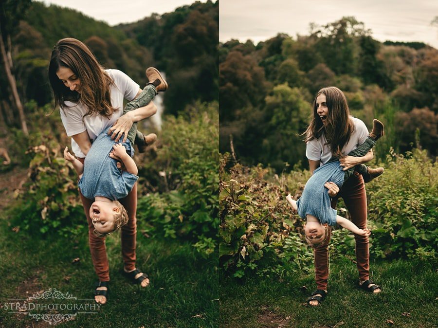 Mother is swinging her son