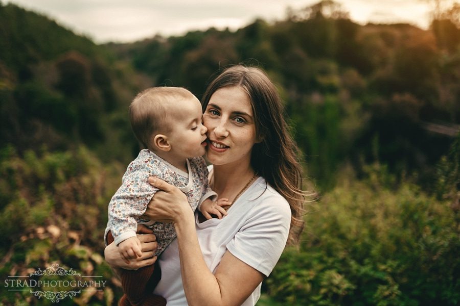 Little girl kisses her mother
