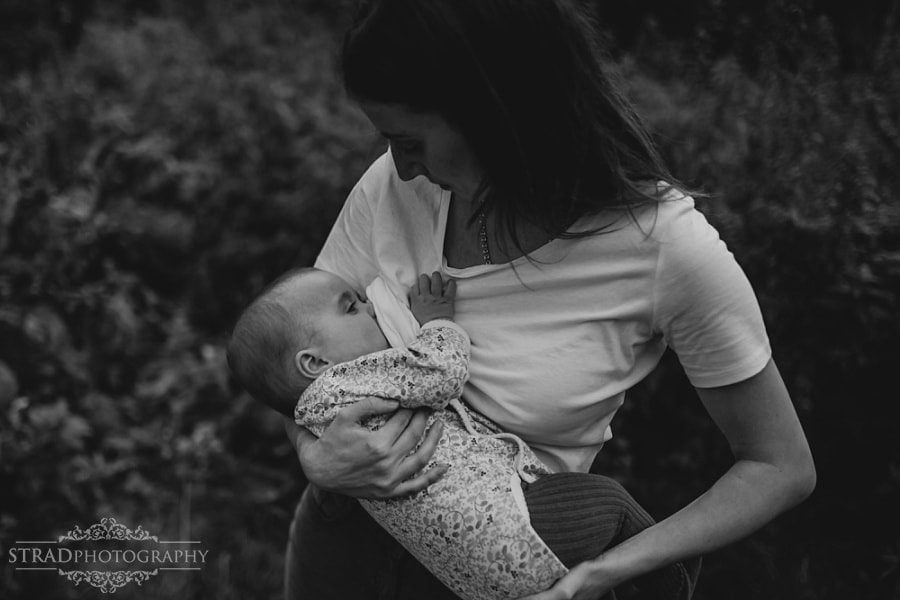 Young mother breastfeeding her daughter