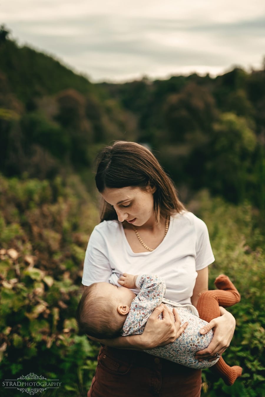 Young mother breastfeeding her daughter