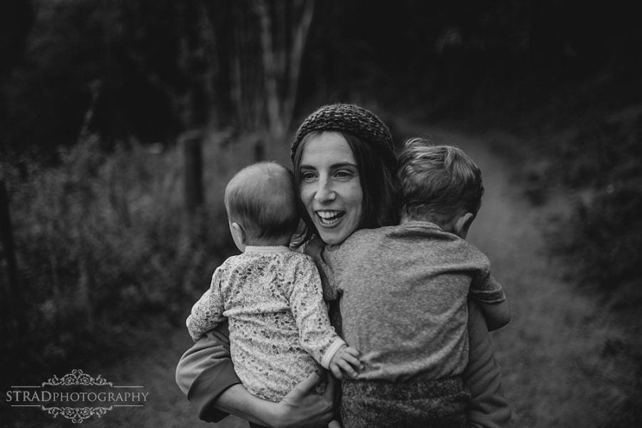 Mom hugs her kids and laughs