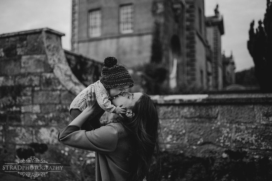 daughter gives her mother a kiss