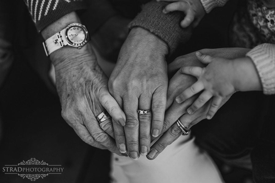 Close up shot of the hands of 4 generation of women