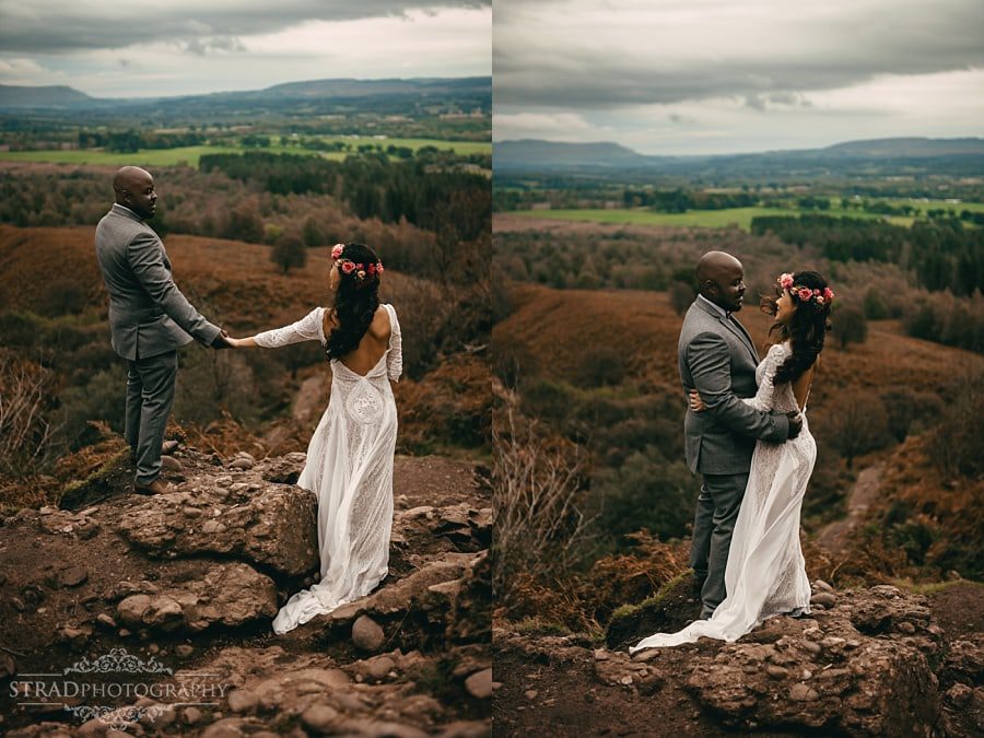 Bride and groom on a rock with a beautiful view 