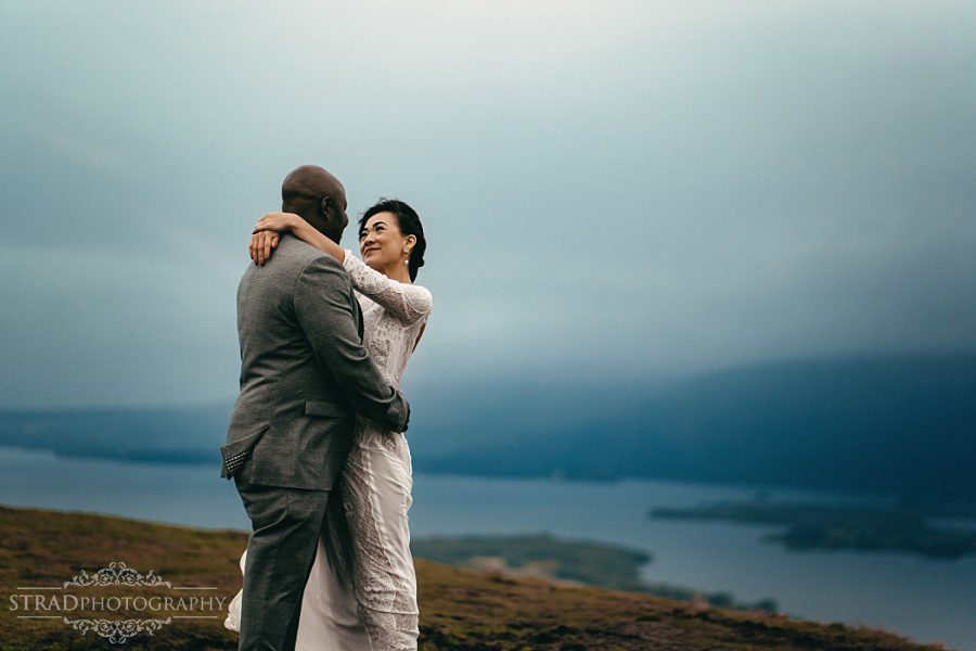 Beautiful photo of the bride and groom on the top of Conic Hill