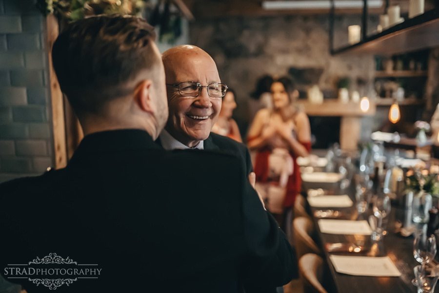 Groom welcoming guests