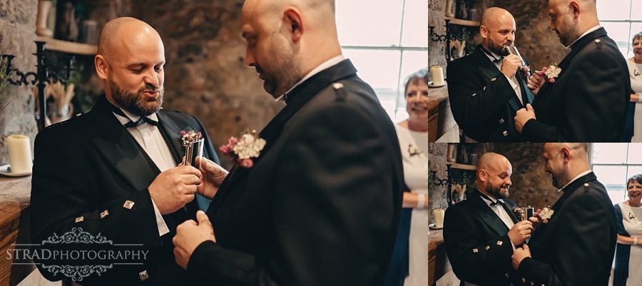 Best man trying a drink from the flask