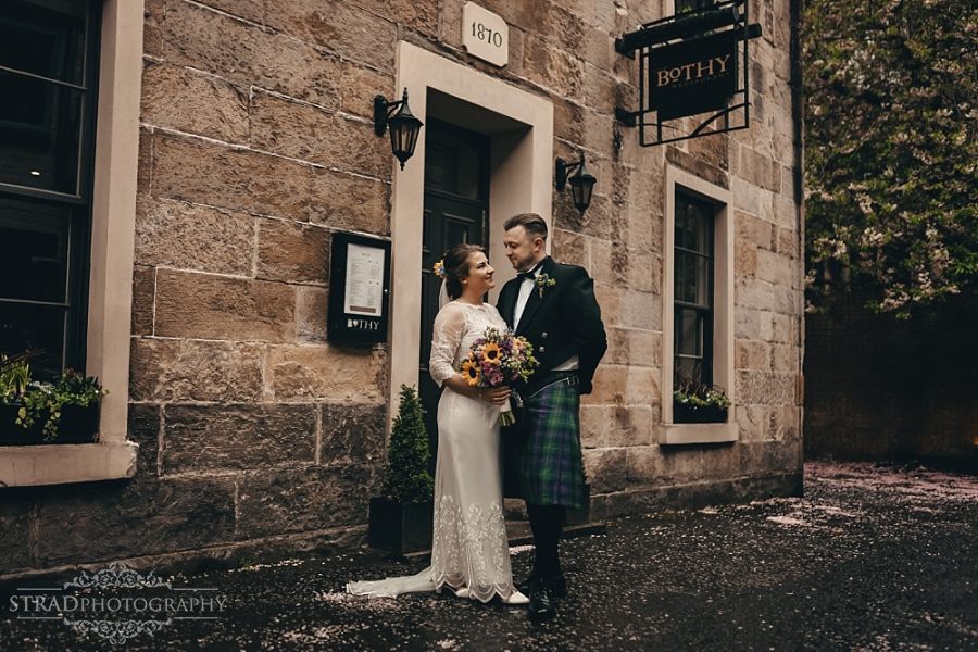 Bride and groom in front of the Bothy restaurant