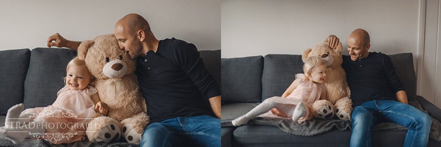 father and daughter having fun on the sofa
