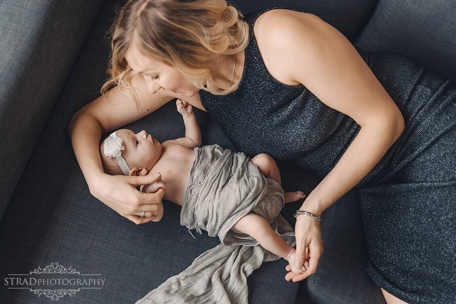 Mother holding her newborn daughter
