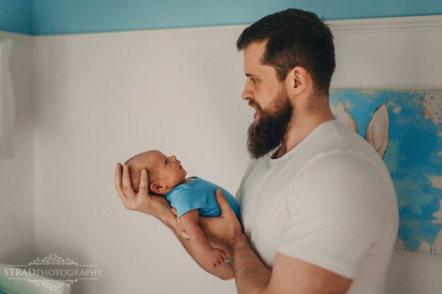 Father holding his newborn baby boy