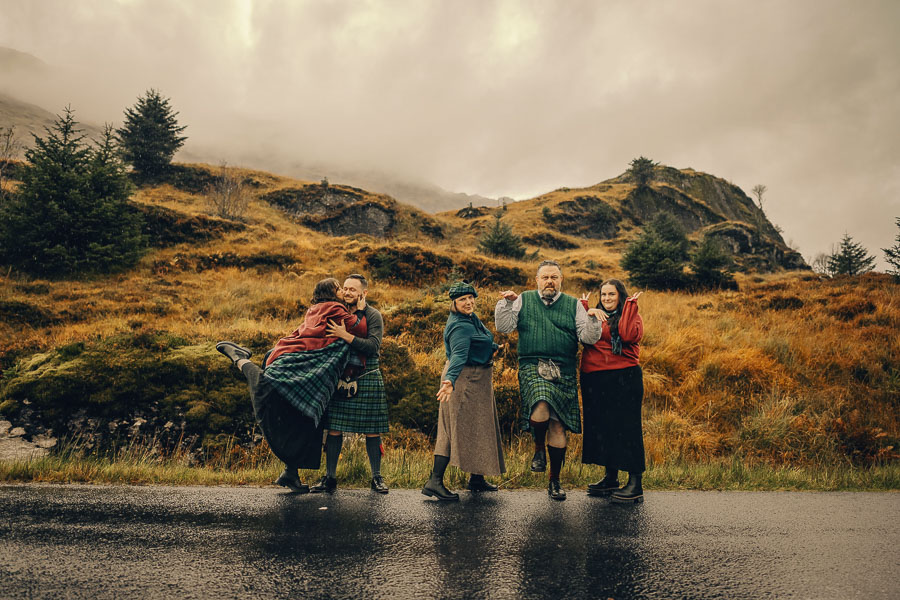 Group in traditional attire outdoors.