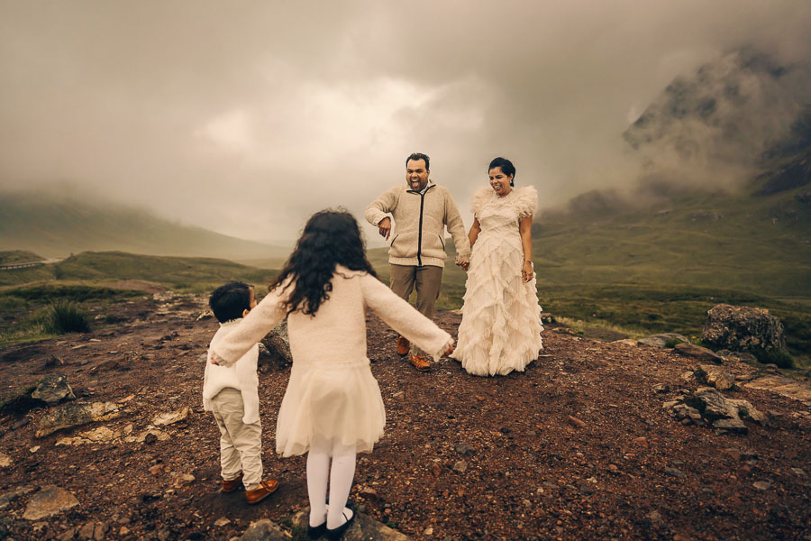 Family in wedding attire outdoors