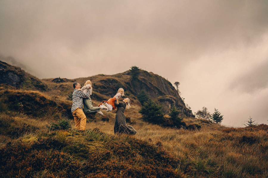Family enjoying a windy hillside outing