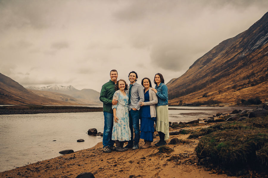 Group portrait by a scenic river.