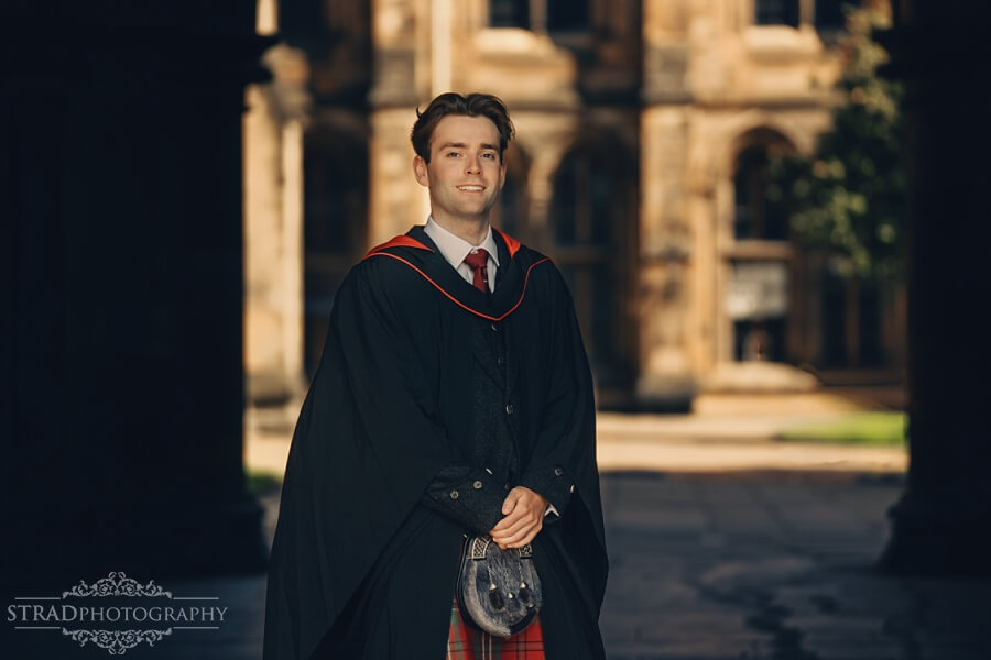 Graduate in traditional academic attire.
