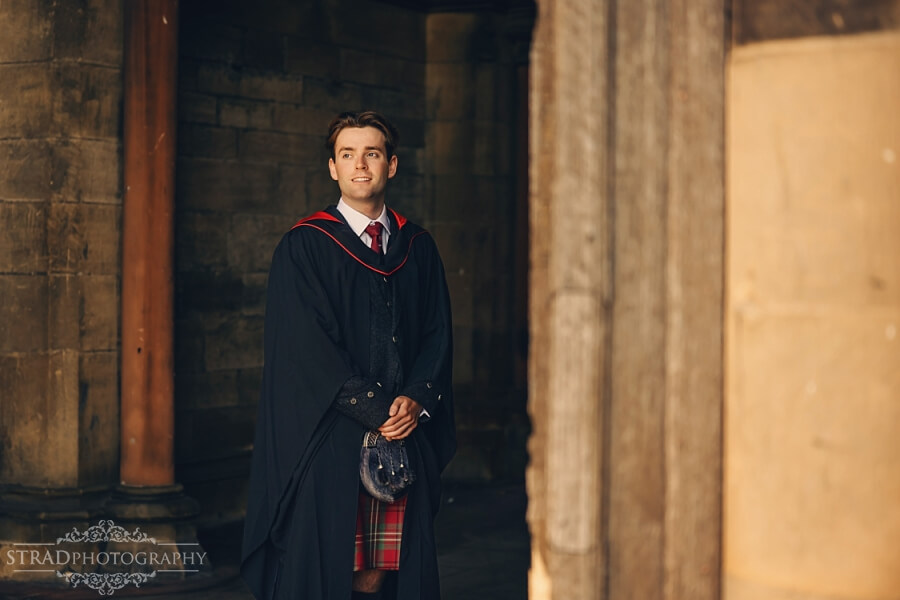 Graduate in traditional academic attire.
