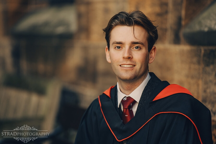 Graduate in traditional academic attire.