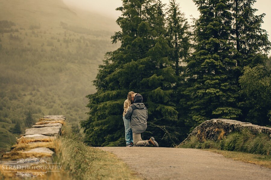 man proposing to his girlfriend on Butter Bridge, Scotland