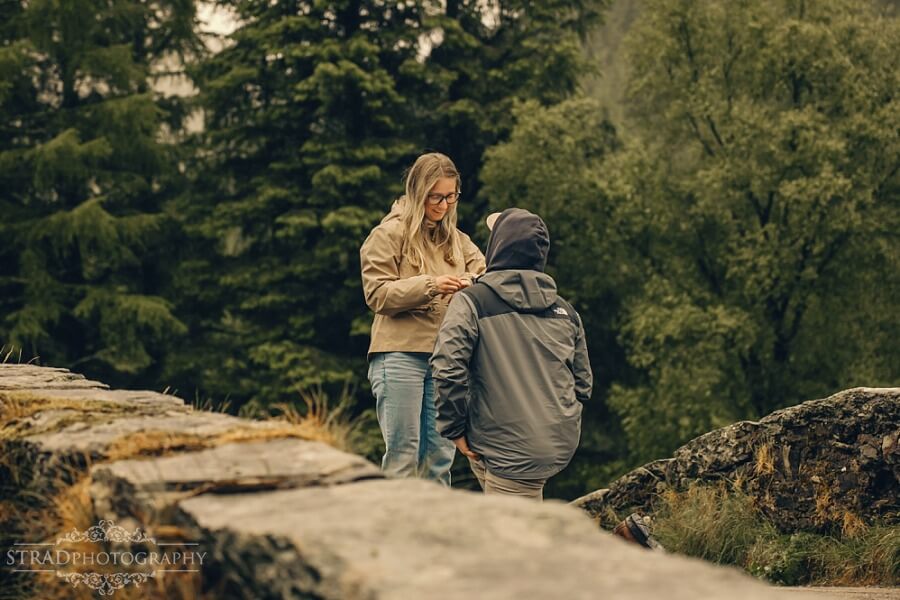 man proposing to his girlfriend on Butter Bridge, Scotland