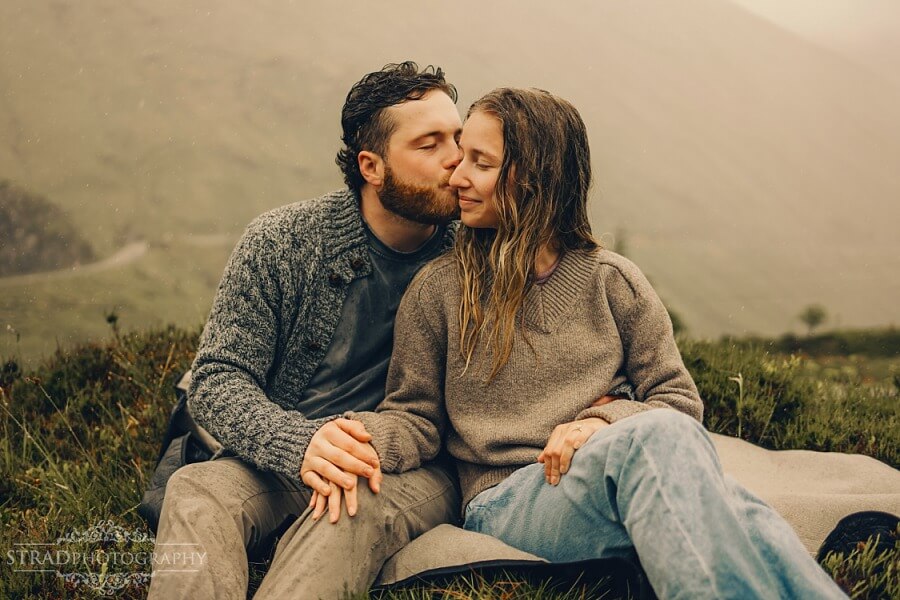 man kisses his girlfriend in the cheek