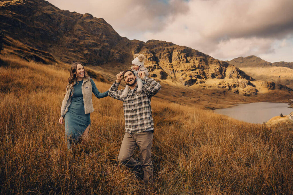 Family enjoying nature in scenic landscape at the Rest and Be Thankful viewpoint