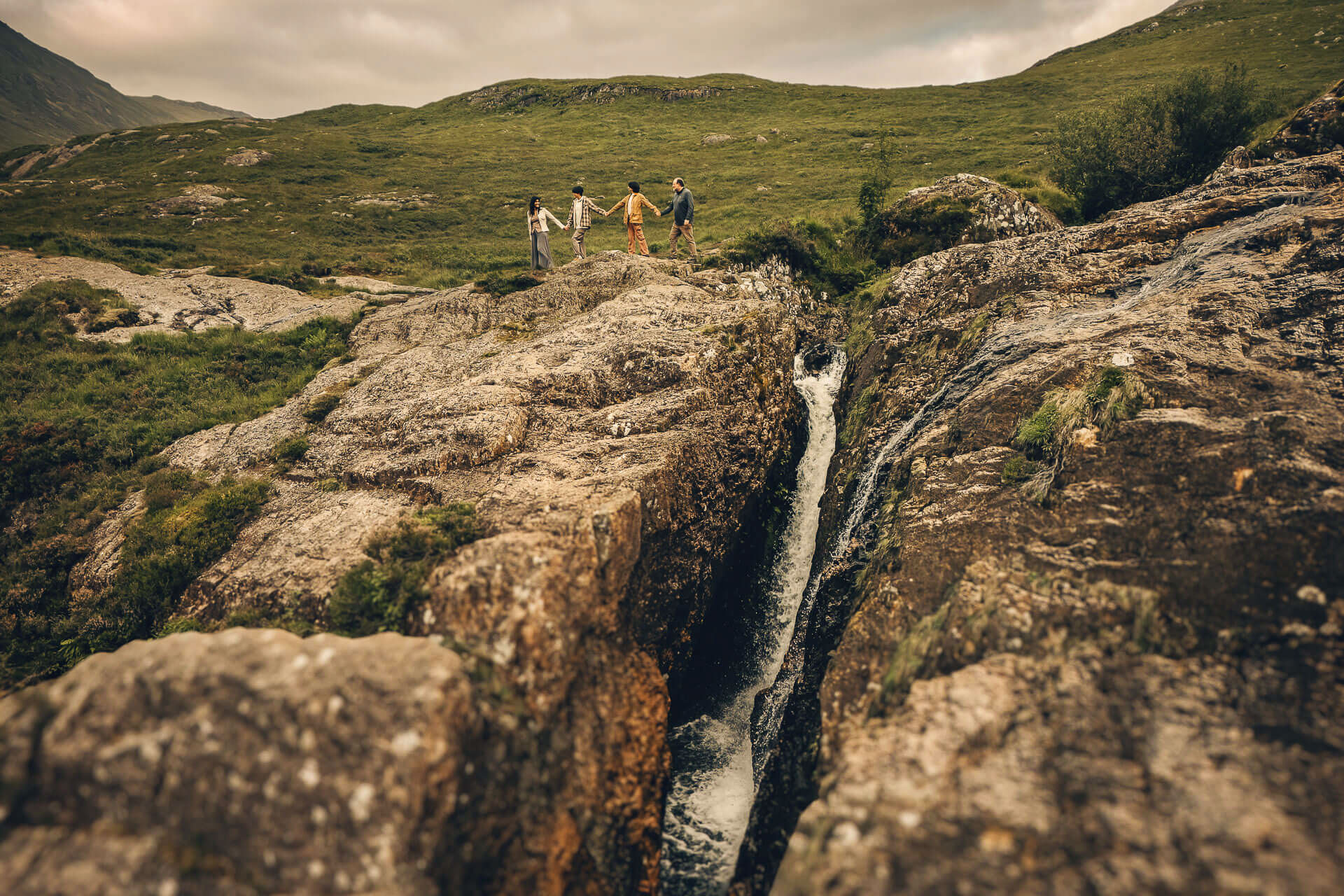 Family standing on rocky landscape