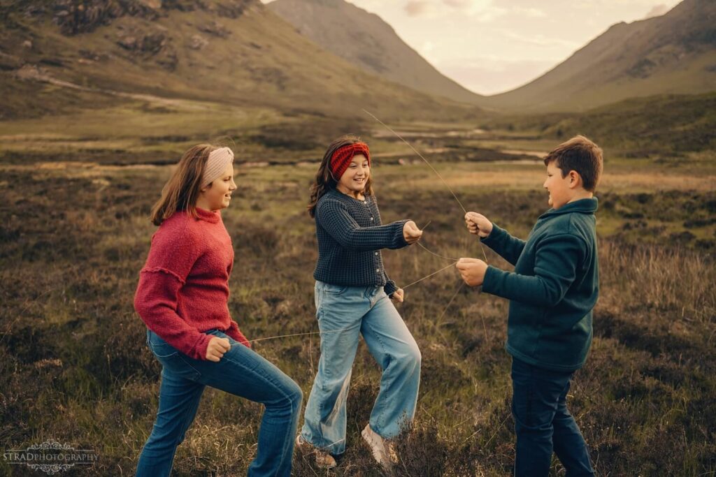 Children playing in scenic landscape.