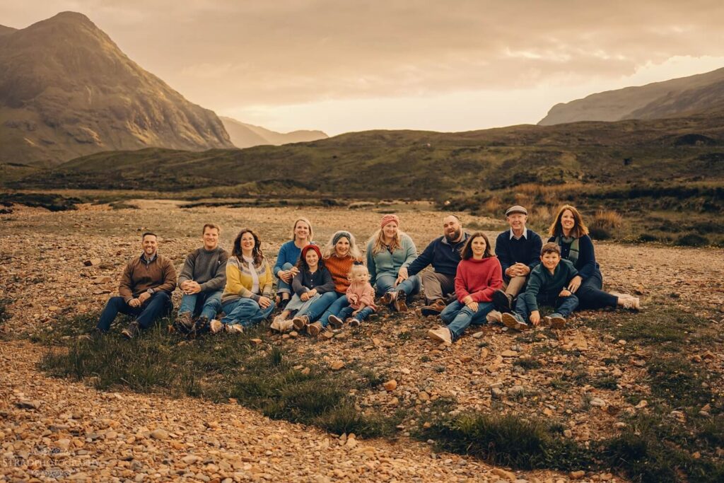 Family gathering in scenic landscape.