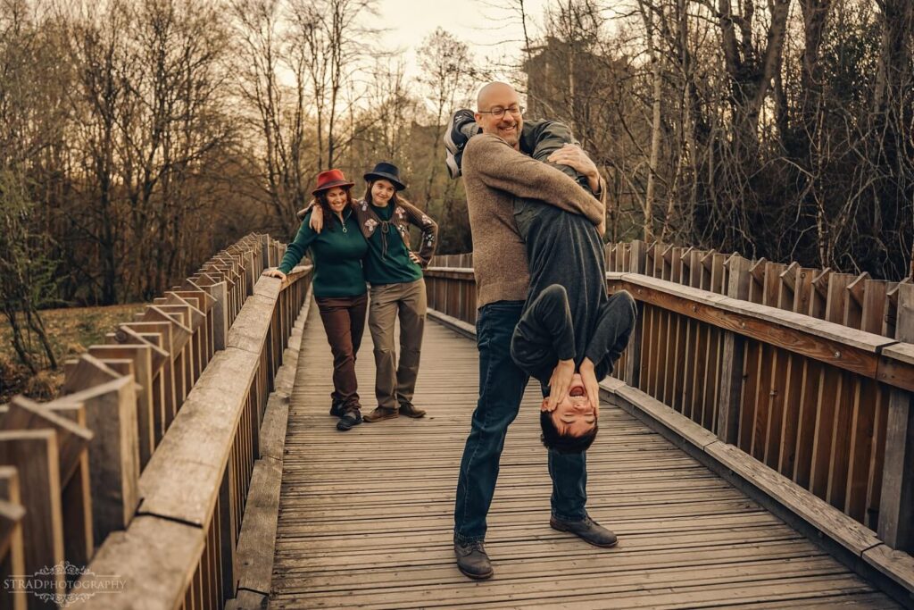 Playful moment on a wooden bridge.