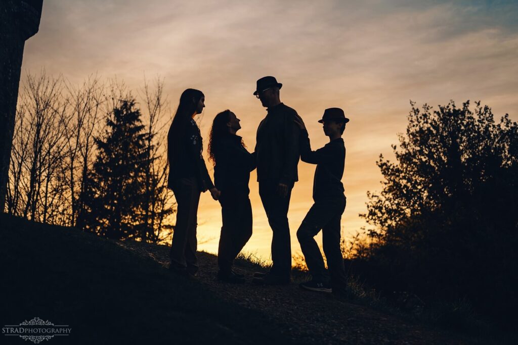 Silhouettes against a sunset backdrop.