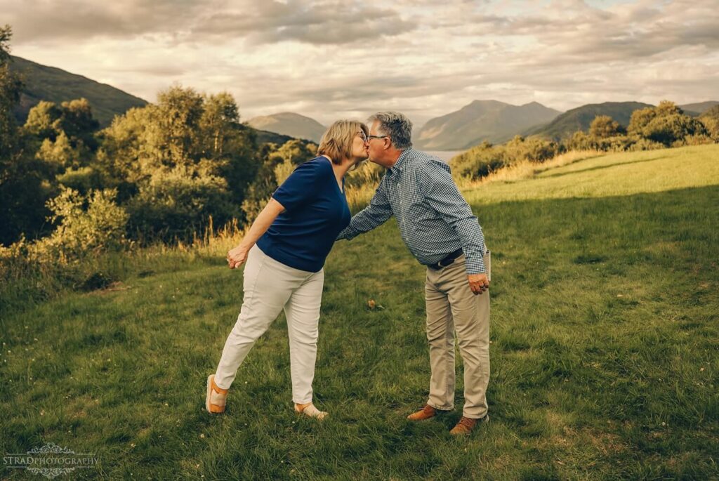 Grandparents kisses outside Port na Milne house.