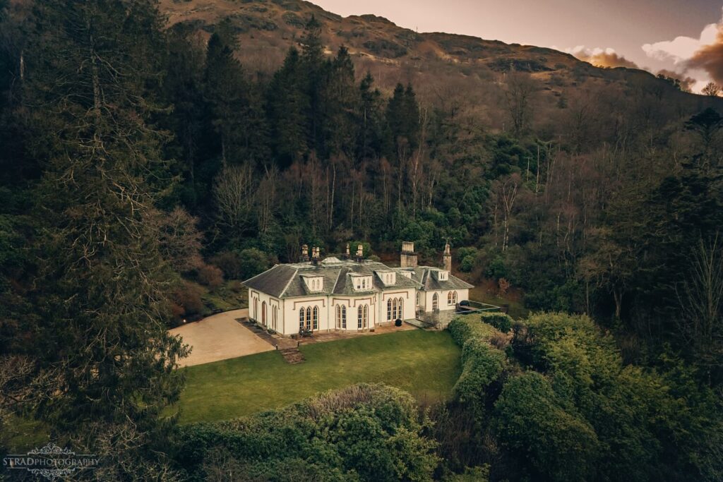Elegant house surrounded by lush greenery.