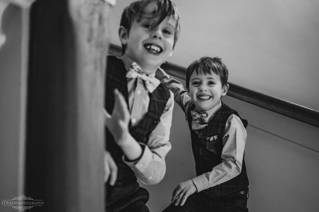 Two boys playing on staircase.